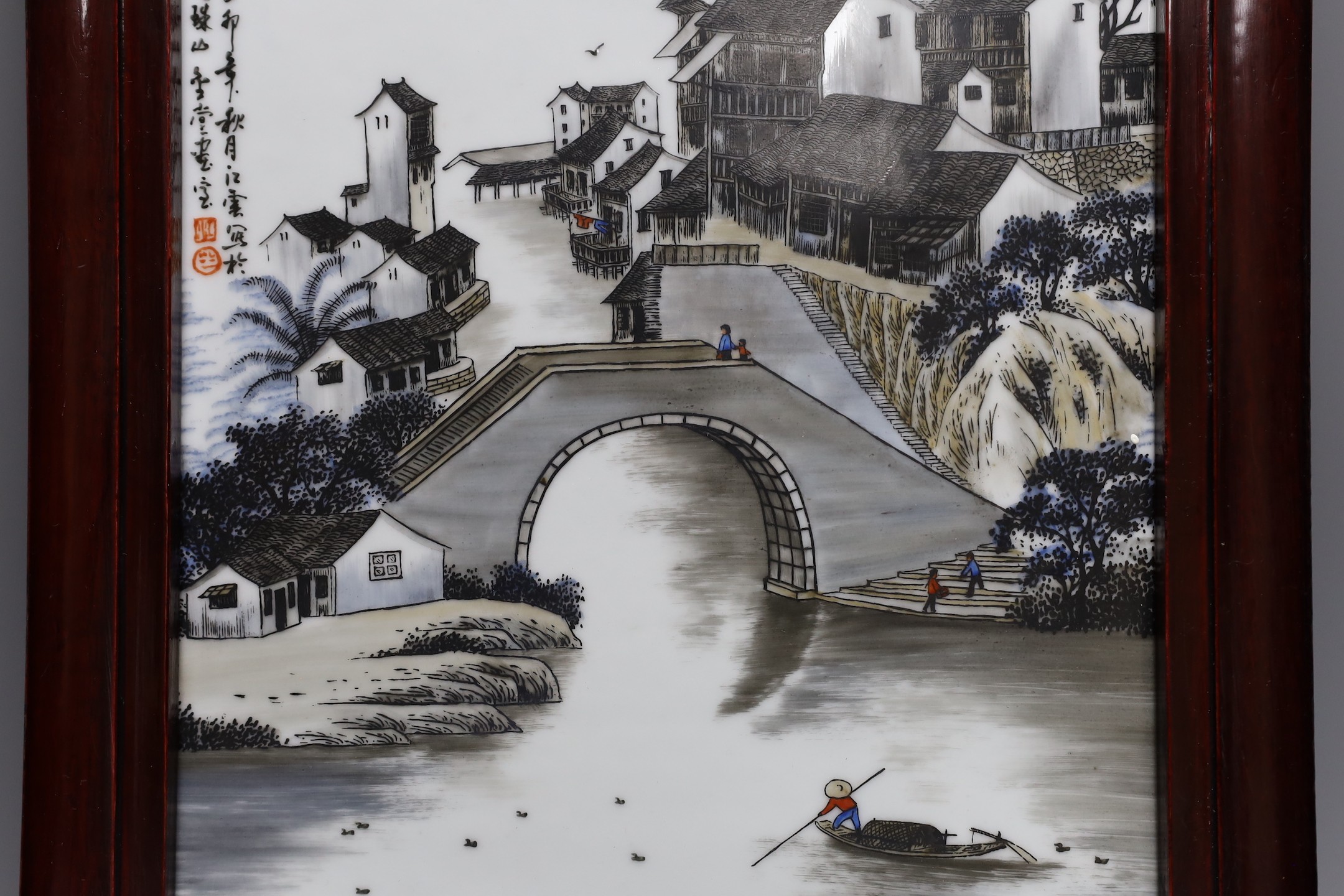 A Chinese porcelain plaque, decorated with a river scene, 34x23cm excl frame